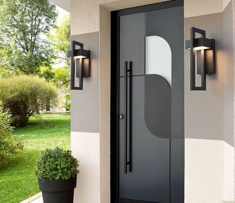 Rectangular black outdoor LED wall lights either side of a front door