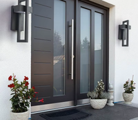 Pair of rectangular outdoor wall lights at a modern entrance