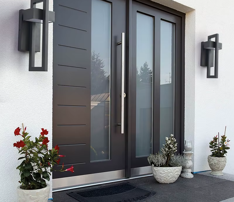 Pair of rectangular outdoor wall lights at a modern entrance