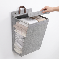 Folding wall-mounted laundry hamper with adhesive hooks – view 6