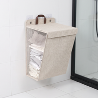 Folding wall-mounted laundry hamper with adhesive hooks – view 5