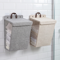 Folding wall-mounted laundry hamper with adhesive hooks – view 8