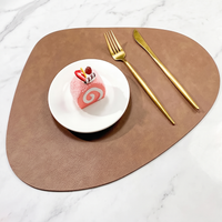 Teardrop two-tone faux leather placemat on marble with plate and gold cutlery – view 20