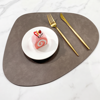 Teardrop two-tone faux leather placemat on marble with plate and gold cutlery – view 13