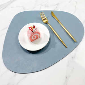 Teardrop two-tone faux leather placemat on marble with plate and gold cutlery – view 17