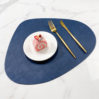 Teardrop two-tone faux leather placemat on marble with plate and gold cutlery – view 19
