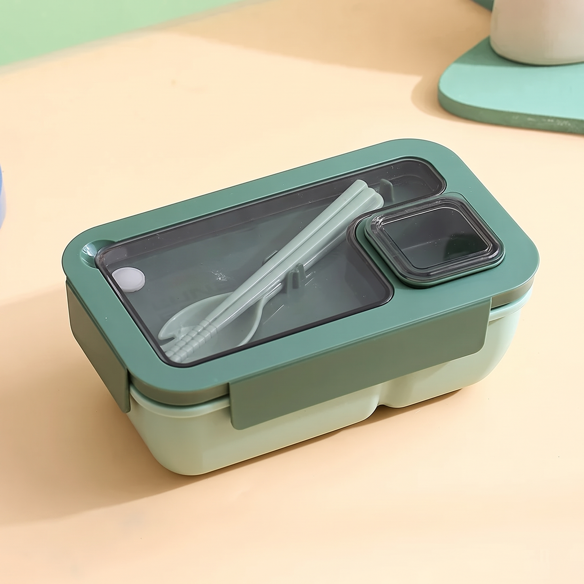 Two-compartment bento lunch box with spoon and fork in the lid – view 7