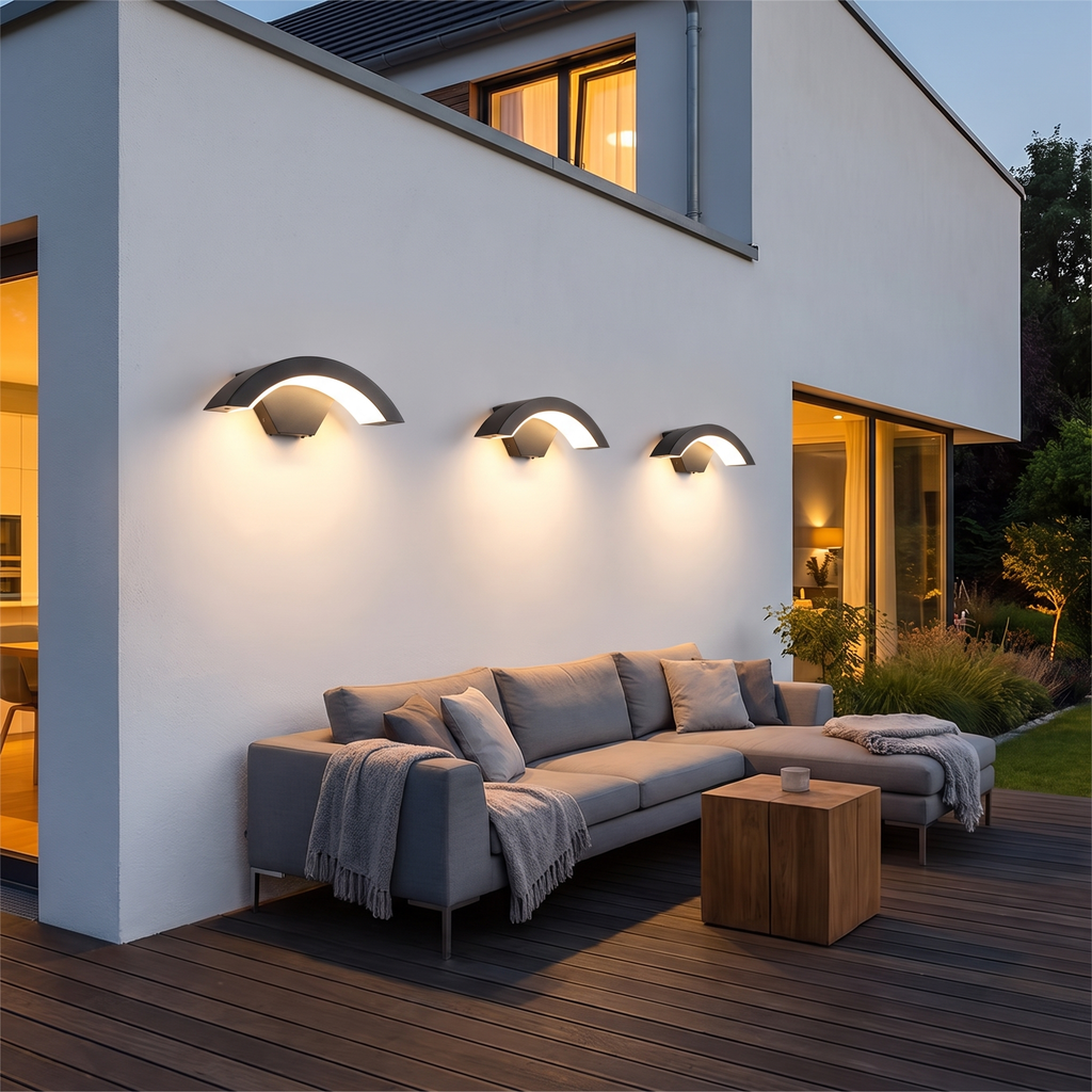 Curved outdoor LED wall light on a house facade at dusk – view 8