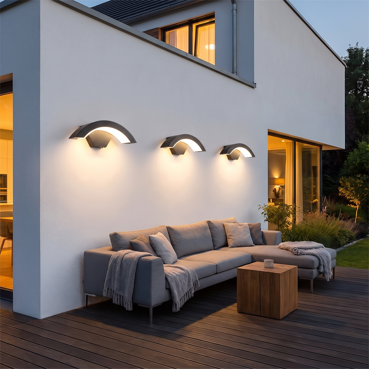 Curved outdoor LED wall light on a house facade at dusk – view 8