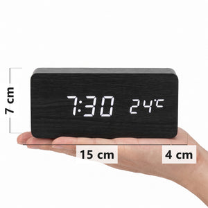 Black wood-grain LED alarm clock in hand, 15 x 7 x 4 cm