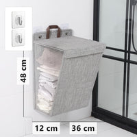 Grey wall-mounted folding laundry hamper, 48 x 36 x 12 cm, with adhesive hooks